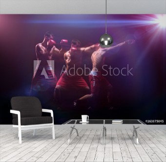 Picture of The boxer boxing in a dark studio